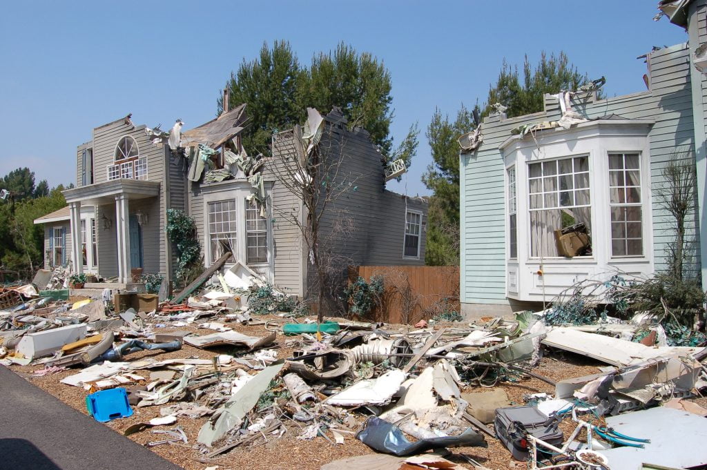 Damaged houses and debris after a hurricane.