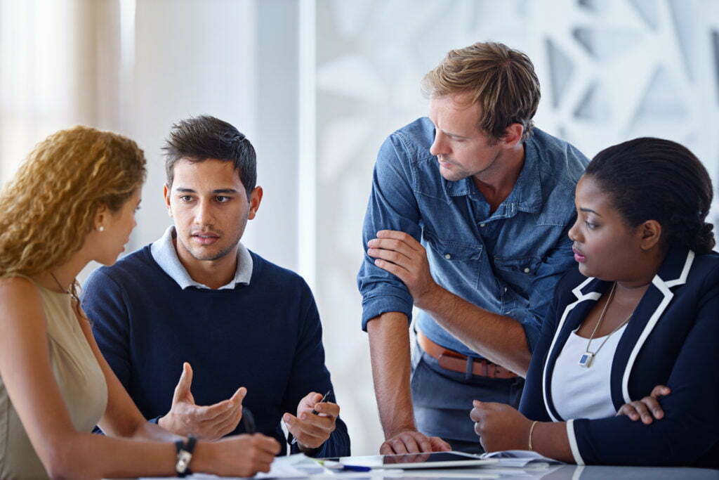 A group of community leaders working together in an office. 